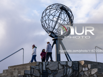 Tourists watches the steel globe in North Cape, Nordkapp, Norway on September 27, 2024. Nordkapp or North Cape is considered the northernmos...