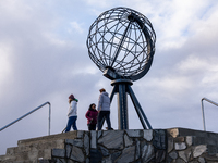 Tourists watches the steel globe in North Cape, Nordkapp, Norway on September 27, 2024. Nordkapp or North Cape is considered the northernmos...