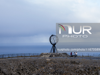 Tourists watches the steel globe in North Cape, Nordkapp, Norway on September 27, 2024. Nordkapp or North Cape is considered the northernmos...