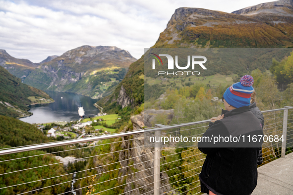 Tourists visit Geiranger, Norway, on September 18, 2024. Geiranger Fjord, a major tourist attraction in Norway, was designated a UNESCO Worl...