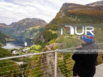 Tourists visit Geiranger, Norway, on September 18, 2024. Geiranger Fjord, a major tourist attraction in Norway, was designated a UNESCO Worl...