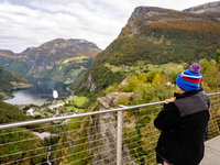 Tourists visit Geiranger, Norway, on September 18, 2024. Geiranger Fjord, a major tourist attraction in Norway, was designated a UNESCO Worl...