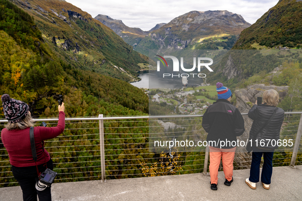 Tourists visit Geiranger, Norway, on September 18, 2024. Geiranger Fjord, a major tourist attraction in Norway, was designated a UNESCO Worl...