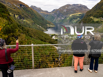 Tourists visit Geiranger, Norway, on September 18, 2024. Geiranger Fjord, a major tourist attraction in Norway, was designated a UNESCO Worl...