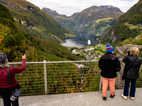 Tourists visit Geiranger, Norway, on September 18, 2024. Geiranger Fjord, a major tourist attraction in Norway, was designated a UNESCO Worl...