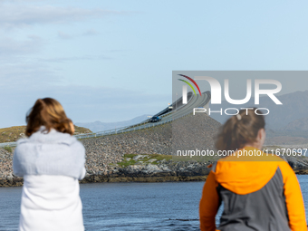 Tourists take pictures on a bridge along the Atlantic Ocean Road in Norway on September 18, 2024. The Atlantic Road was voted the most beaut...