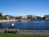 An elderly person sits on a bench overlooking the sea in Kristiansand, Norway on September 13, 2024. Kristiansand is a city and municipality...