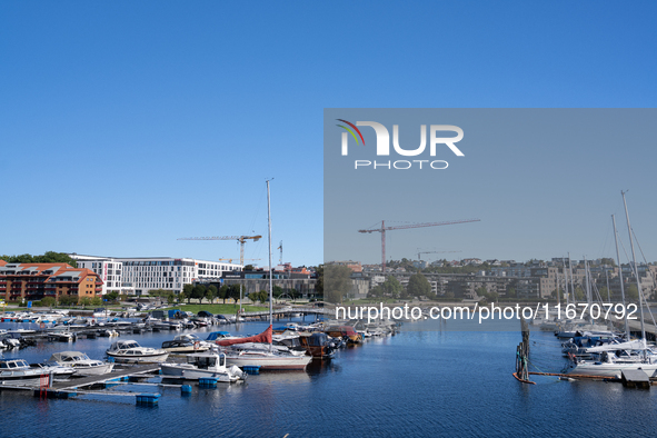 Boats at the harbor in Kristiansand, Norway on September 13, 2024. Kristiansand is a city and municipality in Agder county, Norway. The city...