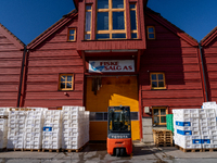 A forklift is parked outside a seafood processing facility in Kristiansand, Norway, on September 13, 2024.  Kristiansand is a city and munic...