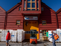 A forklift is parked outside a seafood processing facility in Kristiansand, Norway, on September 13, 2024.  Kristiansand is a city and munic...