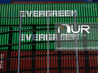 Evergreen containers are stacked at the port  in Kristiansand, Norway on September 13, 2024. Kristiansand is a city and municipality in Agde...