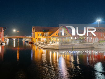 A general view of Fiskebrygga (The Fish Wharf) at night, in Kristiansand, Norway on September 13, 2024. Fiskebrygga  is a former fish landin...