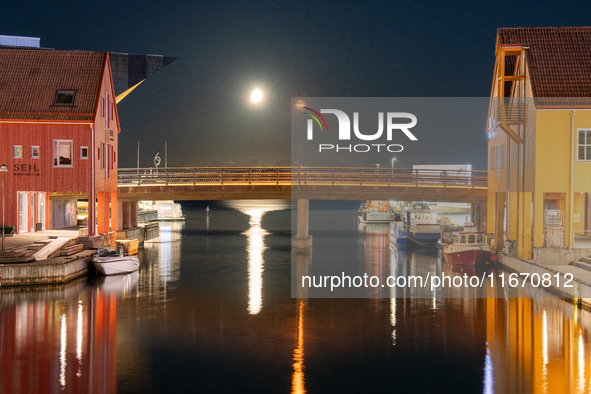 A general view of Fiskebrygga (The Fish Wharf) at night with moon reflecting on sea, in Kristiansand, Norway on September 13, 2024. Fiskebry...