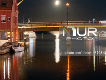 A general view of Fiskebrygga (The Fish Wharf) at night with moon reflecting on sea, in Kristiansand, Norway on September 13, 2024. Fiskebry...