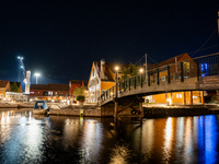 A general view of Fiskebrygga (The Fish Wharf) at night, in Kristiansand, Norway on September 13, 2024. Fiskebrygga  is a former fish landin...