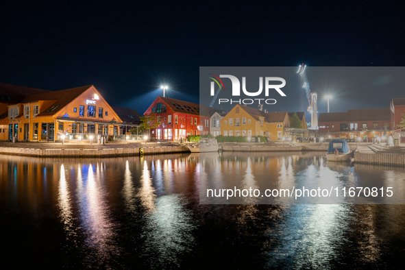 A general view of Fiskebrygga (The Fish Wharf) at night, in Kristiansand, Norway on September 13, 2024. Fiskebrygga  is a former fish landin...