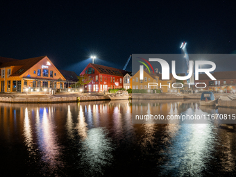 A general view of Fiskebrygga (The Fish Wharf) at night, in Kristiansand, Norway on September 13, 2024. Fiskebrygga  is a former fish landin...