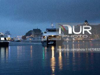 An electric tourist ferry arrives at the Bergen's harbor, in Bergen, Norway, on September 15, 2024. Bergen is the second-largest city in Nor...