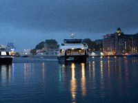 An electric tourist ferry arrives at the Bergen's harbor, in Bergen, Norway, on September 15, 2024. Bergen is the second-largest city in Nor...