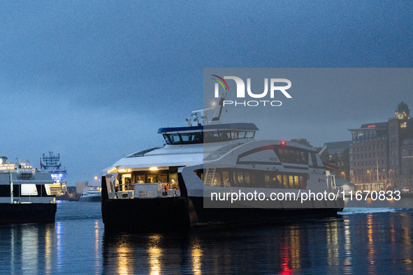 An electric tourist ferry arrives at the Bergen's harbor, in Bergen, Norway, on September 15, 2024. Bergen is the second-largest city in Nor...