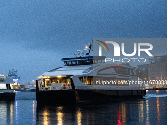 An electric tourist ferry arrives at the Bergen's harbor, in Bergen, Norway, on September 15, 2024. Bergen is the second-largest city in Nor...