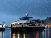 An electric tourist ferry arrives at the Bergen's harbor, in Bergen, Norway, on September 15, 2024. Bergen is the second-largest city in Nor...