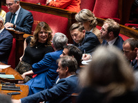 Barnier government ministers sit among the parliamentary benches during question time in Paris, France, on October 16, 2024. (