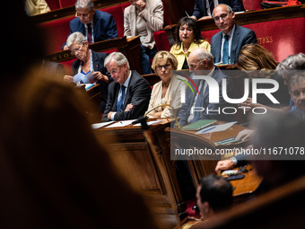 Prime Minister Michel Barnier (left) is at the National Assembly alongside Nathalie Delattre, Minister in Charge of Relations with the Parli...