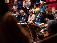 Prime Minister Michel Barnier (left) is at the National Assembly alongside Nathalie Delattre, Minister in Charge of Relations with the Parli...