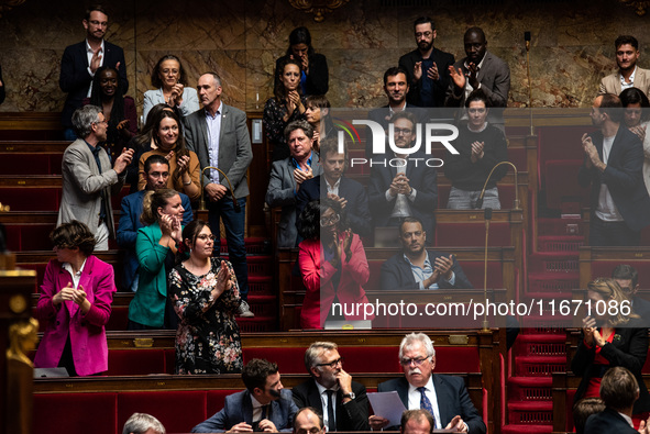 The deputies of La France Insoumise stand and applaud MP Loic Prud'homme's speech against the construction of some heavily contested high-sp...