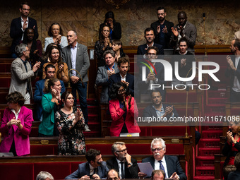 The deputies of La France Insoumise stand and applaud MP Loic Prud'homme's speech against the construction of some heavily contested high-sp...