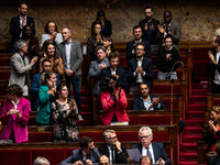 The deputies of La France Insoumise stand and applaud MP Loic Prud'homme's speech against the construction of some heavily contested high-sp...