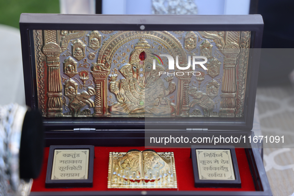 Pure silver and gold-plated puja items are displayed at a small stall selling various puja items during the Sree Ganesh Chaturthi Mahotsav f...