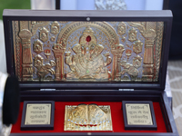 Pure silver and gold-plated puja items are displayed at a small stall selling various puja items during the Sree Ganesh Chaturthi Mahotsav f...