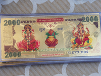 Swiss gold bars with the images of the Goddess Lakshmi and Lord Ganesh are displayed at a small stall selling various puja items during the...