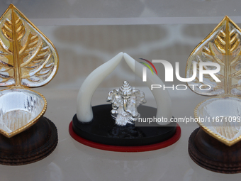 A small pure silver idol of Lord Ganesh is displayed at a stall selling puja items during the Sree Ganesh Chaturthi Mahotsav festival in Bra...