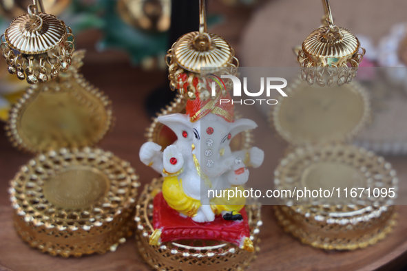 A small idol of Lord Ganesh is displayed at a stall selling various puja items during the Sree Ganesh Chaturthi Mahotsav festival in Brampto...