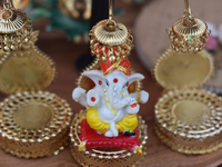 A small idol of Lord Ganesh is displayed at a stall selling various puja items during the Sree Ganesh Chaturthi Mahotsav festival in Brampto...