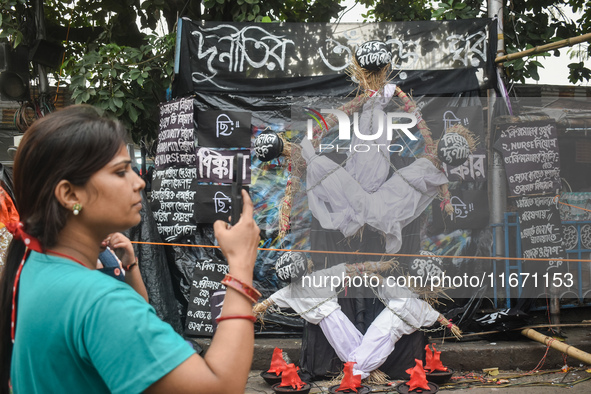 Junior doctors make effigies disputing health corruption at a protest site in Kolkata, India, on October 16, 2024. 