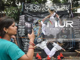 Junior doctors make effigies disputing health corruption at a protest site in Kolkata, India, on October 16, 2024. (