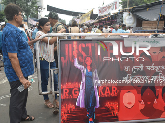 Citizens attend the Junior Doctors hunger strike to protest the rape and murder case of a medic in a government-run hospital in Kolkata, Ind...