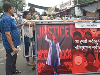 Citizens attend the Junior Doctors hunger strike to protest the rape and murder case of a medic in a government-run hospital in Kolkata, Ind...