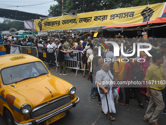 Citizens attend the Junior Doctors hunger strike to protest the rape and murder case of a medic in a government-run hospital in Kolkata, Ind...