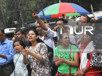 Citizens shout slogans while they attend the Junior Doctors hunger strike to protest the rape and murder case of a medic in a government-run...