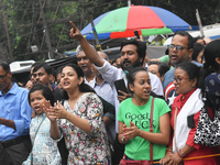 Citizens shout slogans while they attend the Junior Doctors hunger strike to protest the rape and murder case of a medic in a government-run...