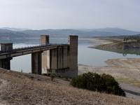 Visible banks, dry soil, and uncultivated vegetation replace the water at Lake Monte Cotugno, a reservoir in Basilicata, which in the summer...