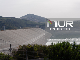 Visible banks, dry soil, and uncultivated vegetation replace the water at Lake Monte Cotugno, a reservoir in Basilicata, which in the summer...