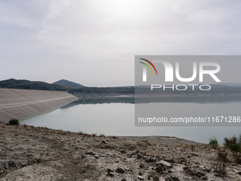 Visible banks, dry soil, and uncultivated vegetation replace the water at Lake Monte Cotugno, a reservoir in Basilicata, which in the summer...