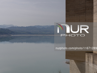 Visible banks, dry soil, and uncultivated vegetation replace the water at Lake Monte Cotugno, a reservoir in Basilicata, which in the summer...