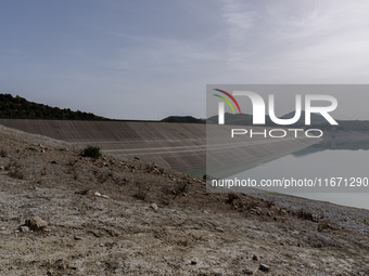 Visible banks, dry soil, and uncultivated vegetation replace the water at Lake Monte Cotugno, a reservoir in Basilicata, which in the summer...